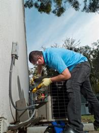 Man checking the AC