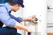 Mechanic checking water heater