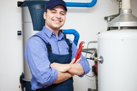 Plumber Maintaining Water Heater