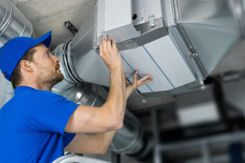 Technician working on HVAC System