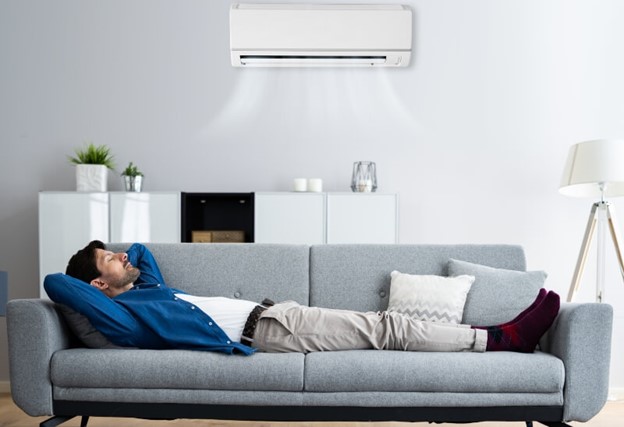Man enjoying cool Air on his Sofa