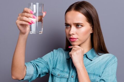 Woman observing Drinking Water