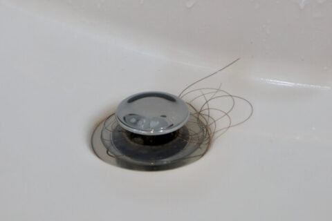 clogged bathroom sink with hair