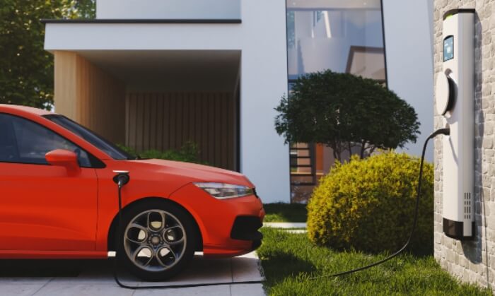 Car getting charged with Electric Car Charging Station Outside the House
