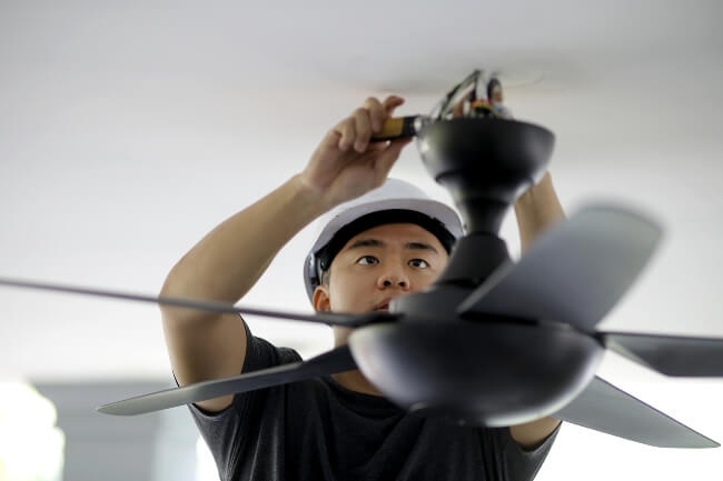 Man Installing New Ceiling Fan in Utah & Washington Counties