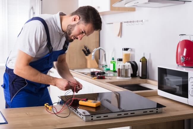 man working on an home electrical appliance