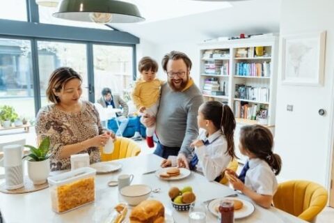 Happy Family eating breakfast together - Triple T