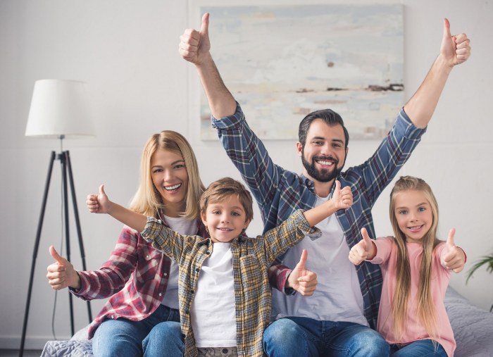 Happy family showing thumbs up, enjoying fresh indoor air in Utah – Triple-T