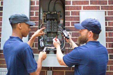 electricians working on home circuit breaker box in Utah
